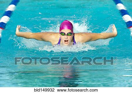 Stock Image - Caucasian swimmer in swimming lane. Fotosearch