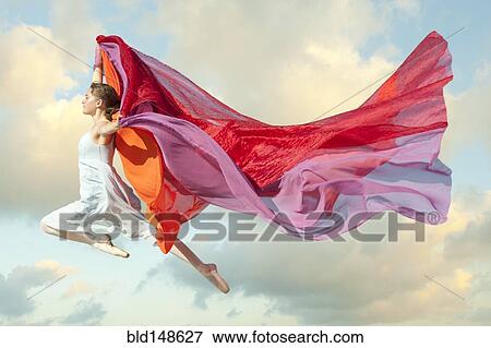 Caucasian woman floating through air with scarves View Large Photo Image Stock Photo - Caucasian woman floating through air with scarves. Fotosearch