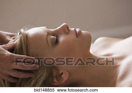 Stock Photography - Caucasian woman receiving head massage. Fotosearch