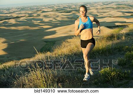 Caucasian woman running in remote area View Large Photo Image Stock Image - Caucasian woman running in remote area. Fotosearch