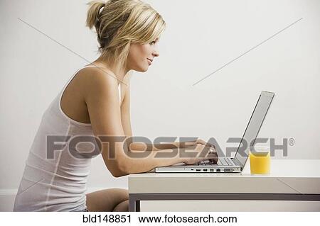 Caucasian woman using laptop View Large Photo Image Stock Image - Caucasian woman using laptop. Fotosearch