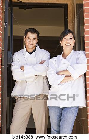 Chinese chefs standing in restaurant doorway View Large Photo Image Stock Photo - Chinese chefs standing in restaurant doorway. Fotosearch