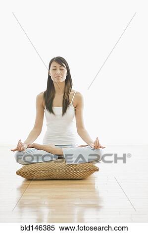 Stock Photography - Chinese woman practicing yoga. Fotosearch