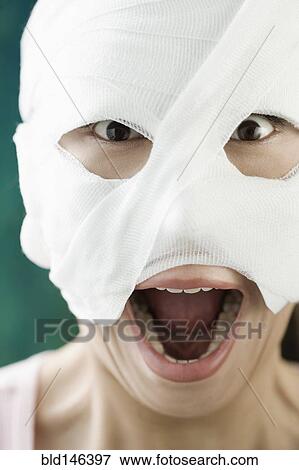Chinese woman with bandaged face View Large Photo Image Stock Photo - Chinese woman with bandaged face. Fotosearch