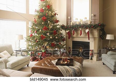 Stock Photography - Christmas tree and decorations in living room. Fotosearch