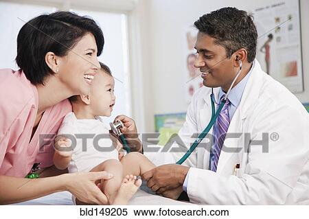 Doctor and nurse examining baby in doctor's office View Large Photo Image Stock Photography - Doctor and nurse examining baby in doctor's office. Fotosearch