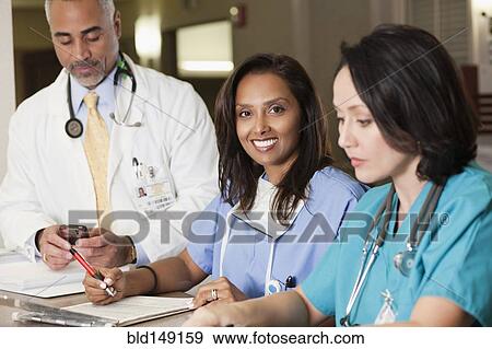 Doctors and nurse working in hospital View Large Photo Image Stock Photo - Doctors and nurse working in hospital. Fotosearch