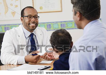 Father and son in doctor's office View Large Photo Image Stock Image - Father and son in doctor's office. Fotosearch
