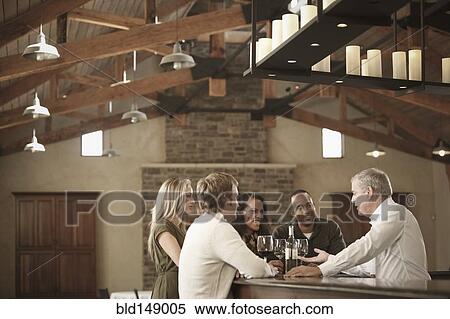 Stock Photography - Friends drinking wine together. Fotosearch