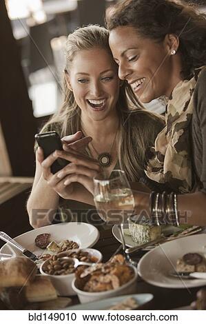 Friends having lunch and drinking wine together View Large Photo Image Stock Image - Friends having lunch and drinking wine together. Fotosearch