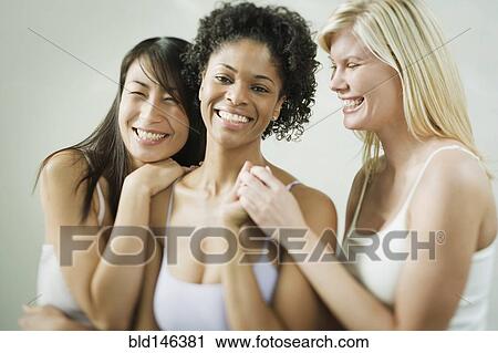 Friends holding hands and smiling View Large Photo Image Stock Image - Friends holding hands and smiling. Fotosearch