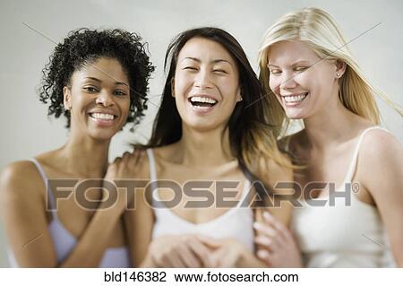 Friends laughing together View Large Photo Image Stock Image - Friends laughing together. Fotosearch