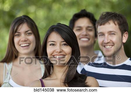 Friends smiling outdoors View Large Photo Image Stock Photo - Friends smiling outdoors. Fotosearch