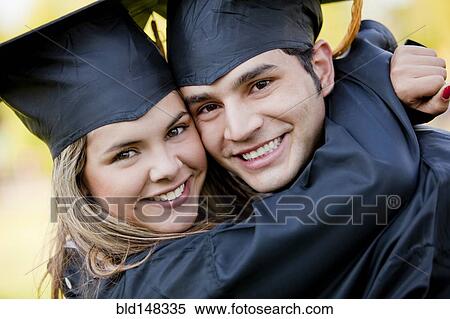 Graduating Hispanic couple in cap and gown hugging View Large Photo Image Stock Photography - Graduating Hispanic couple in cap and gown hugging. Fotosearch