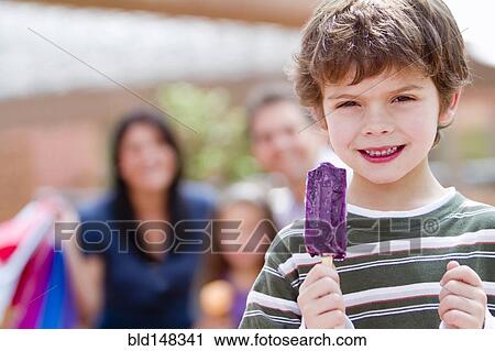 Hispanic boy eating popsicle View Large Photo Image Stock Image - Hispanic boy eating popsicle. Fotosearch