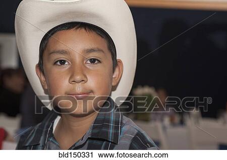 Hispanic boy wearing cowboy hat View Large Photo Image Stock Image - Hispanic boy wearing cowboy hat. Fotosearch