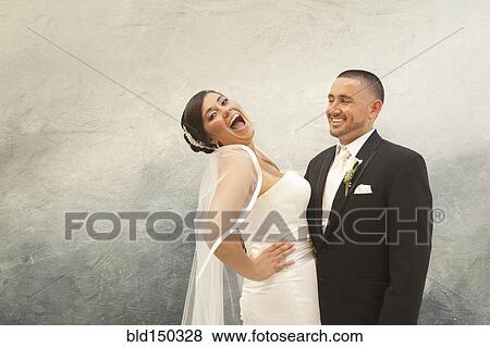 Hispanic bride and groom laughing View Large Photo Image Stock Photo - Hispanic bride and groom laughing. Fotosearch