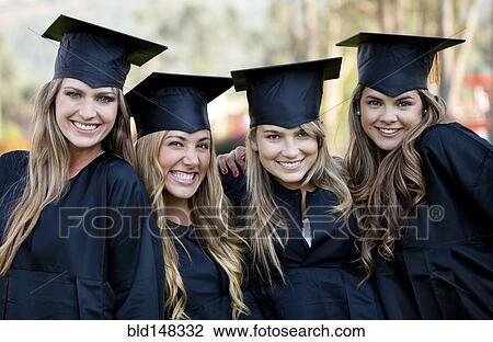 Hispanic college graduates standing together in caps and gowns View Large Photo Image Stock Image - Hispanic college graduates standing together in caps and gowns. Fotosearch