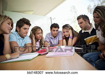Hispanic college students doing homework View Large Photo Image Stock Photo - Hispanic college students doing homework. Fotosearch