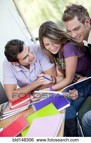 Hispanic college students doing homework View Large Photo Image Stock Photograph - Hispanic college students doing homework. Fotosearch