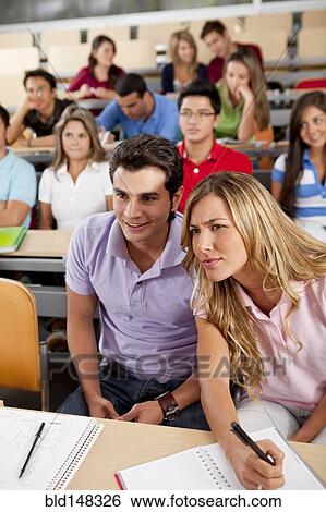 Hispanic college students sitting in classroom View Large Photo Image Stock Photograph - Hispanic college students sitting in classroom. Fotosearch