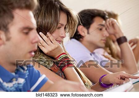 Hispanic college students studying in classroom View Large Photo Image Stock Image - Hispanic college students studying in classroom. Fotosearch