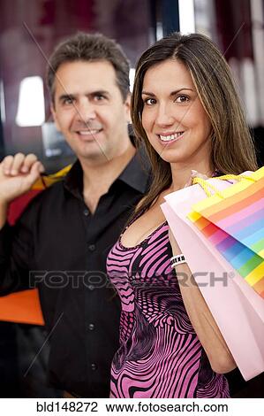 Hispanic couple shopping together View Large Photo Image Stock Image - Hispanic couple shopping together. Fotosearch