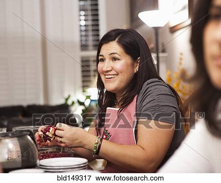 Hispanic family preparing Thanksgiving dinner View Large Photo Image Stock Photo - Hispanic family preparing Thanksgiving dinner. Fotosearch