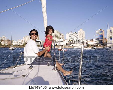 Hispanic father and daughter on sailboat View Large Photo Image Stock Photography - Hispanic father and daughter on sailboat. Fotosearch
