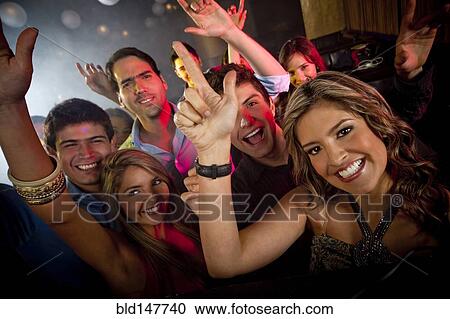 Hispanic friends dancing in nightclub View Large Photo Image Stock Image - Hispanic friends dancing in nightclub. Fotosearch