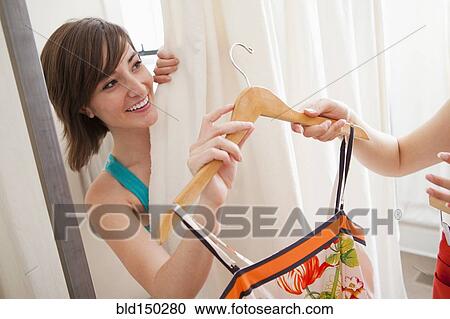 Hispanic friends shopping in clothing store View Large Photo Image Stock Image - Hispanic friends shopping in clothing store. Fotosearch