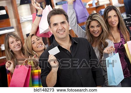 Stock Image - Hispanic friends shopping together. Fotosearch