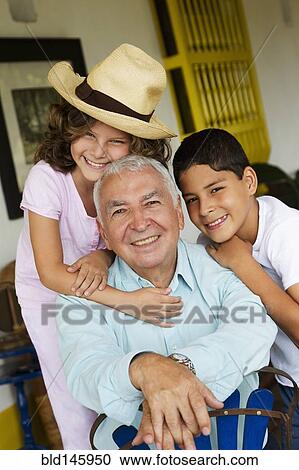 Hispanic grandchildren hugging grandfather View Large Photo Image Stock Image - Hispanic grandchildren hugging grandfather. Fotosearch