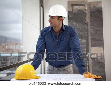 Hispanic man in hard-hat on construction site View Large Photo Image Stock Image - Hispanic man in hard-hat on construction site. Fotosearch