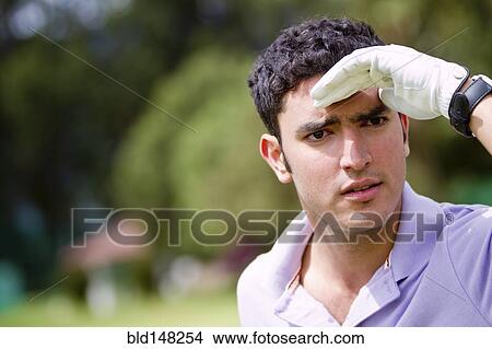 Hispanic man searching for golf ball View Large Photo Image Picture - Hispanic man searching for golf ball. Fotosearch