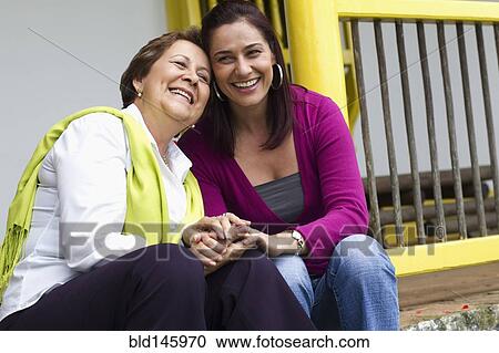 Hispanic mother and daughter sitting on steps together View Large Photo Image Stock Image - Hispanic mother and daughter sitting on steps together. Fotosearch