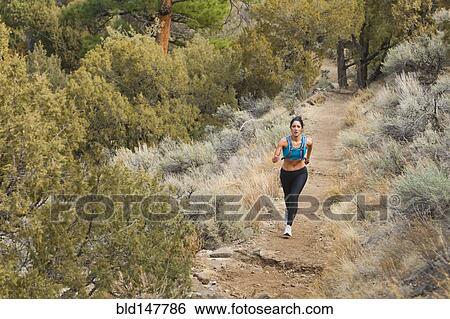 Hispanic runner training in remote area View Large Photo Image Stock Photograph - Hispanic runner training in remote area. Fotosearch