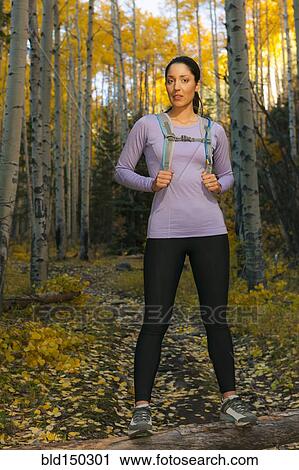 Hispanic woman hiking in woods View Large Photo Image Stock Image - Hispanic woman hiking in woods. Fotosearch