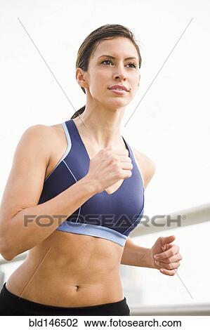 Hispanic woman running View Large Photo Image Stock Image - Hispanic woman running. Fotosearch