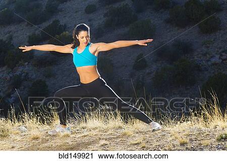 Hispanic woman stretching before exercise View Large Photo Image Stock Image - Hispanic woman stretching before exercise. Fotosearch