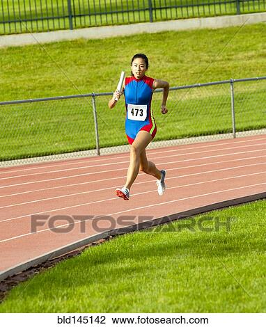 Japanese runner running on racetrack View Large Photo Image Stock Image - Japanese runner running on racetrack. Fotosearch