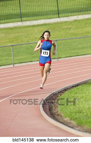 Japanese runner running on racetrack View Large Photo Image Stock Photo - Japanese runner running on racetrack. Fotosearch