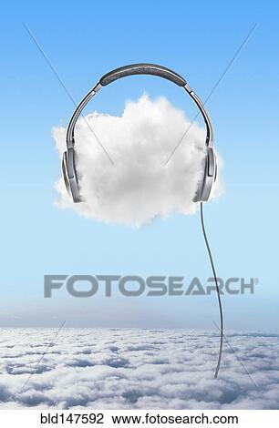 Stock Image - Large headphones on cloud in sky. Fotosearch