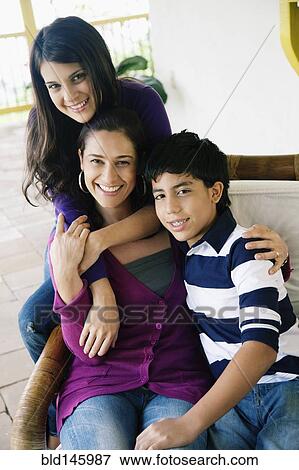 Mother, son and daughter sitting on porch View Large Photo Image Stock Photo - Mother, son and daughter sitting on porch. Fotosearch