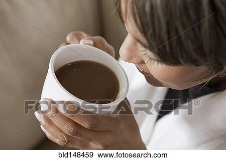 Native American woman drinking coffee View Large Photo Image Stock Photo - Native American woman drinking coffee. Fotosearch