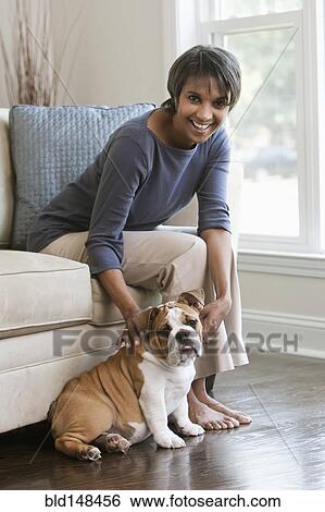 Native American woman petting English bulldog View Large Photo Image Stock Photograph - Native American woman petting English bulldog. Fotosearch