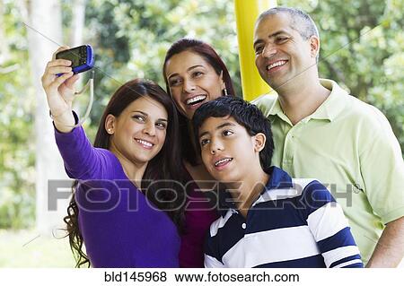 Parents and children taking self-portrait View Large Photo Image Stock Photo - Parents and children taking self-portrait. Fotosearch