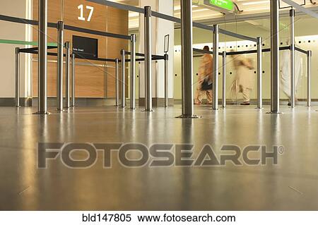 People walking in airport View Large Photo Image Stock Photography - People walking in airport. Fotosearch