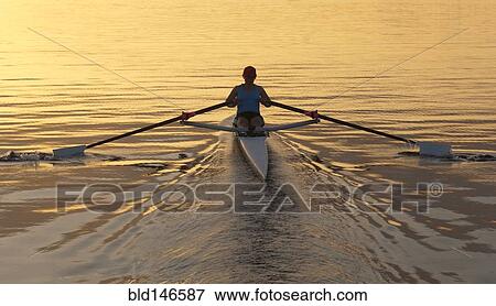 Person rowing sculling boat on river View Large Photo Image Stock Photo - Person rowing sculling boat on river. Fotosearch