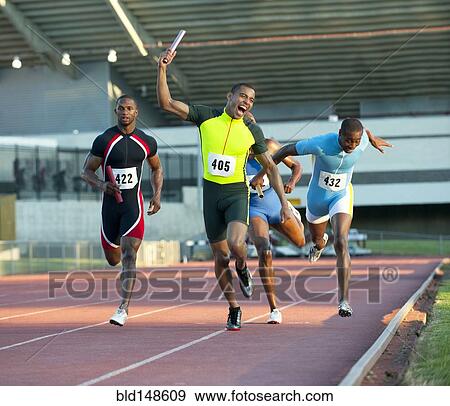 Relay racer crossing finish line on track in race View Large Photo Image Stock Photo - Relay racer crossing finish line on track in race. Fotosearch